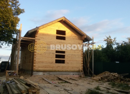 Дом 7х13 м с беседкой из обрезного бруса 150х200 мм в Московской области
