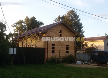 Дом 7х13 м с беседкой из обрезного бруса 150х200 мм в Московской области